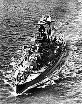 Aerial photograph of the ship. Both the Norwegian flag and White Ensign are visible