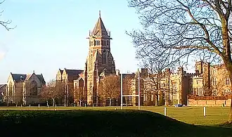 Rugby School buildings, with a rugby football field in the foreground