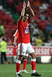 Rui Costa, clapping his hands over his head after scoring a goal