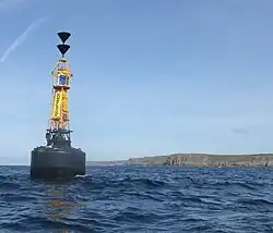 Cardinal mark anchored to the south of the Runnel Stone to guide ships away from the reef