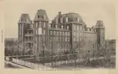 A black-and-white photo of a building housing a scholarly institution