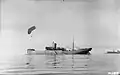 Antenna raising in 1915. The kite balloon ship HMS CANNING anchored off Salonika with kite balloon aloft, November 1915.