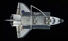 Top view of a spaceplane in space.