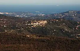 Saint-Cézaire-sur-Siagne viewed from Mons, Var. Cannes is visible in the background with the islands in the bay.