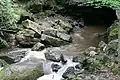 Small tributary of the Sainte-Anne River at its exit from the cave of Trou du diable, a few meters from its mouth