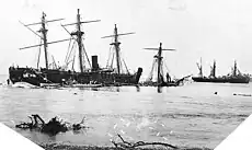 Wrecked vessels at Apia Harbour, Upolu, Samoa, during salvage efforts soon after the storm. The view looks about northward, with USS Trenton and the sunken USS Vandalia to the left and the beached German corvette Olga at right. The wreckage just off Trenton's stern may be from the German gunboat Eber, which was destroyed when she struck the harbor reef during the hurricane.