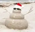 A "sandman" constructed from wet sand on Indian Rocks Beach, Florida.