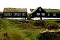 Sands Bygdasavn, the local museum in Sandur, traditional wooden houses with grass roof.