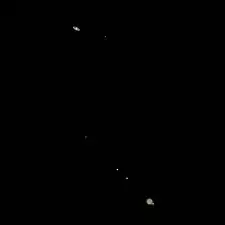 Photograph of the great conjunction of 2020 taken two days before closest approach with the four Galilean moons visible around Jupiter. (Titan can also be seen to the right of Saturn.)