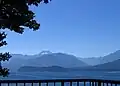 Distant blue mountains separated from viewer by a large body of water