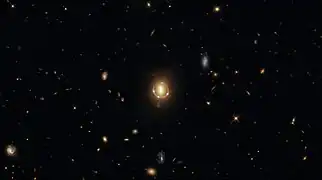 "Seeing Quintuple" a phenomenon known as gravitational lensing.