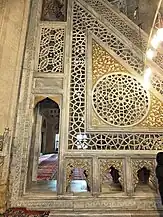 Details of the stone minbar, including pierced geometric decoration