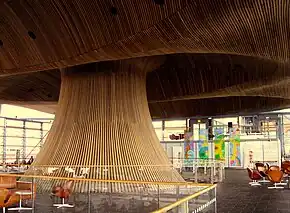 Large wooden funnel with chairs surrounding it