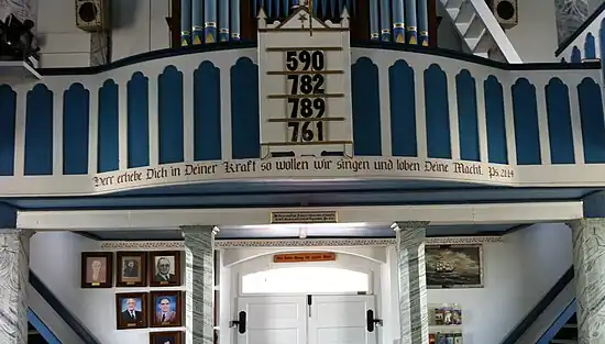 Interior of the church, facing the rear, showing the Bible verse in German, not Wendish/Sorbian