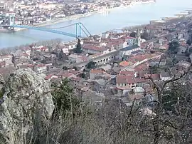 A view of Serrières including the church, railway and suspension bridge