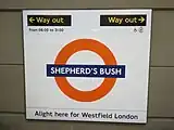 Platform roundel, based on the famous symbol of London Transport, but with Overground orange circle