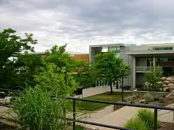 A three-story modernist building on a college campus