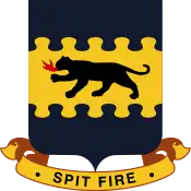 An insignia with a dark four-legged feline breathing fire on a yellow background. There is a blue artistic border at the top and bottom. Below a banner reads "Spit fire".