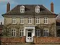 Elm Tree House, built of the local stone in about 1700, with Tuscan porch added later