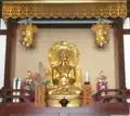 A Buddhist altar in Kawasaki, Japan showing a devotional mantra inscribed in Siddham to Shakyamuni Buddha with Japanese pronunciation guide