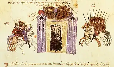 Medieval miniature showing a tall walled city assailed from two sides by cavalry, and soldiers defending it from atop the walls