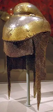 Sikh warrior helmet with butted mail neckguard, 1820–1840, iron overlaid with gold with mail neckguard of iron and brass