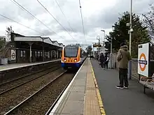 A London Overground train approaching the northbound platform at Silver Street Station