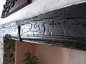 Simonsbath House, Simonsbath, Exmoor Parish, Devon. Wooden lintel over kitchen fireplace with carved date of 1654