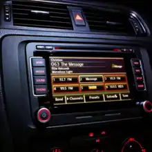 An example of the evolution: 2010's Volkswagen has a smart panel both with buttons and a touch screen to play radio.