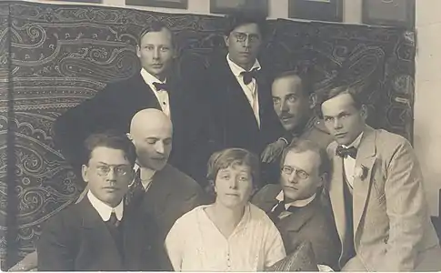 Members of the Estonian Siuru literary circle in 1917, rear: Peet Aren, Otto Krusten, and Johannes Semper. front row: Friedebert Tuglas, Artur Adson, Marie Under, August Gailit, and Henrik Visnapuu