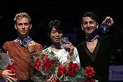 Rippon (left) at the 2013 Skate America podium