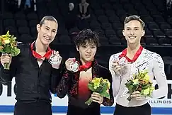 Rippon (right) at the 2016 Skate America podium