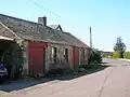 The old Smithy in the mainstreet. The roof on the closest building has since collapsed (2007).