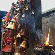 Bells, burning incense, and a smoking candle