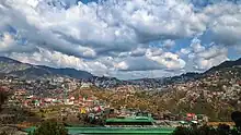 Majestic Hills with houses built all across the Mountains as seen From Rabon