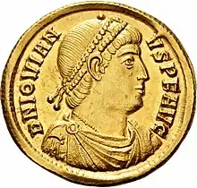 Golden coin depicting man with diadem facing left