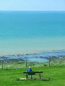 Man sitting alone on a bench