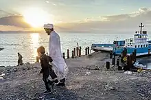 People visiting a boat on Lake Urmia