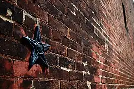 Stars are a common architectural motif from the era of Soulard's building, an anchor plate on brick.