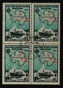 Four identical 40c stamps depicting a map of Antarctica with red flags indicating the bases. Below this are two penguins, a ship and an iceberg.