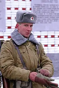 Soviet soldier wearing the ushanka with the winter version of the afghanka; both the afghanka collar and the ushanka are made from "fish fur"