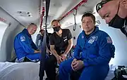 Douglas Hurley prepares to depart a helicopter at Naval Air Station Pensacola.