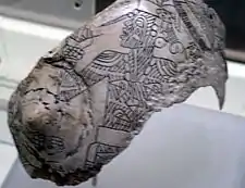 An engraved shell from the Spiro Site, with a tattooed figure