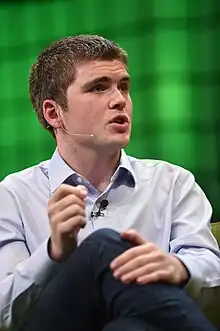 Collison sitting on-stage at Web Summit