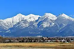 St. Ignatius, Montana. The brick St. Ignatius Mission is visible against the Mission Mountains