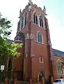 St Dionis, Parsons Green, London, showing the north-east tower of 1896 - one of Christian's last works to be completed but still with his usual stair-turret and pyramidal roof