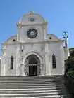 The facade of the cathedral, with the rose window and portal