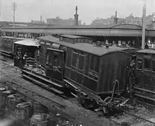 The aftermath of the 1898 St Johns rail accident, where the rear two carriages of a passenger train were telescoped by being hit at 8 mph (13 km/h) by a following train.