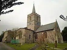 stone church with a slim metal spire