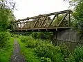 The "Meccano Bridge", a steel truss structure carrying the Wolverhampton Railway Walk (the former Wombourne Branch Line) over the canal in Smestow Valley Local Nature Reserve, Wolverhampton.